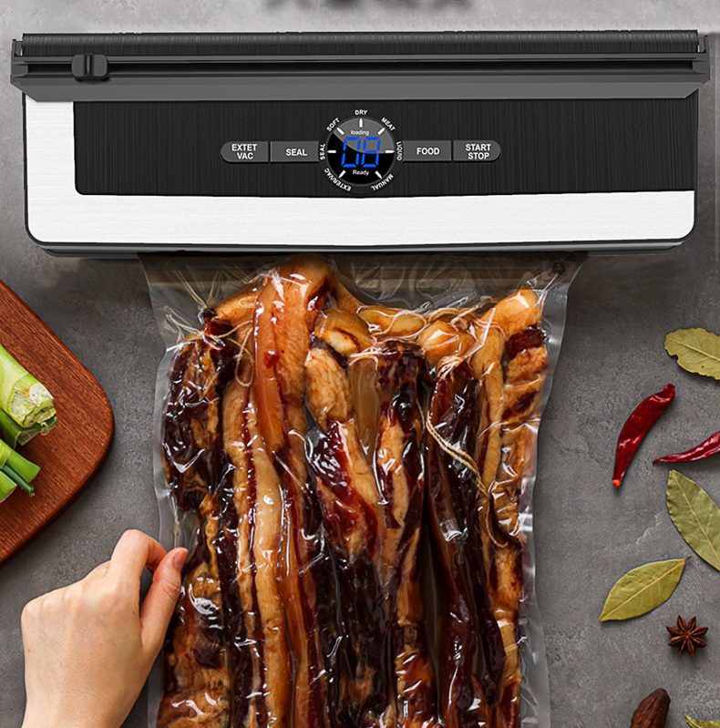 Automatic food vacuum sealer by dealonline.co.nz with 70kpa sealing strength and 135w power, shown sealing food in a bag.
