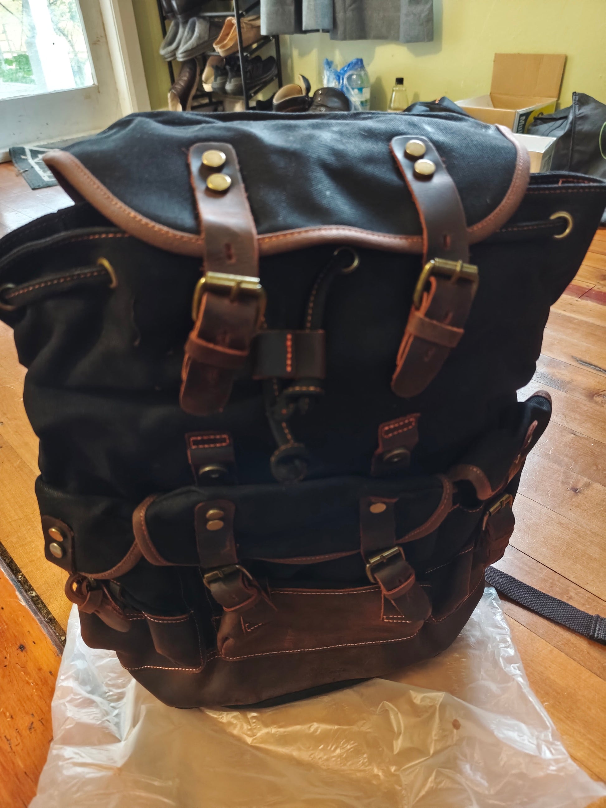 Waxed canvas and leather backpack by Mead's Supply & Equipment Outfitters, featuring a retro heritage design perfect for travel and adventure.
