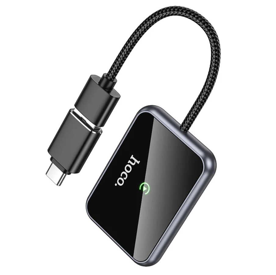 TechPlus Hoco Wireless CarPlay Adapter USB-A to USB-C converter connected to a vehicle's USB port for seamless smartphone integration.