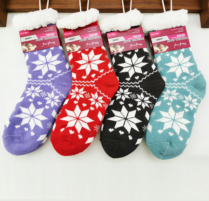 Four pairs of ladies thermal cozy socks from dealonline.co.nz, featuring a 4.7 tog rating for warmth and comfort.