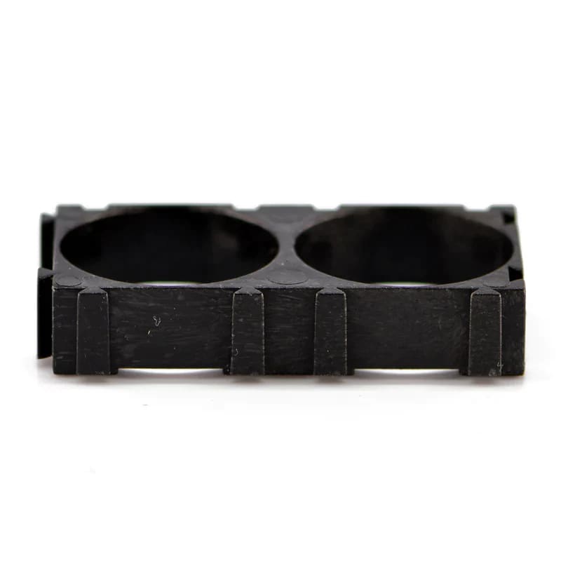 Black 21700 spacer for two batteries with a wooden ring, designed for watch accessories by That Watch Shop.