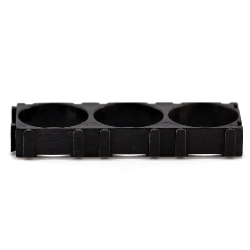 Black 21700 spacer designed for three batteries, compatible with That Watch Shop batteries, showing the cylindrical spacer and batteries.