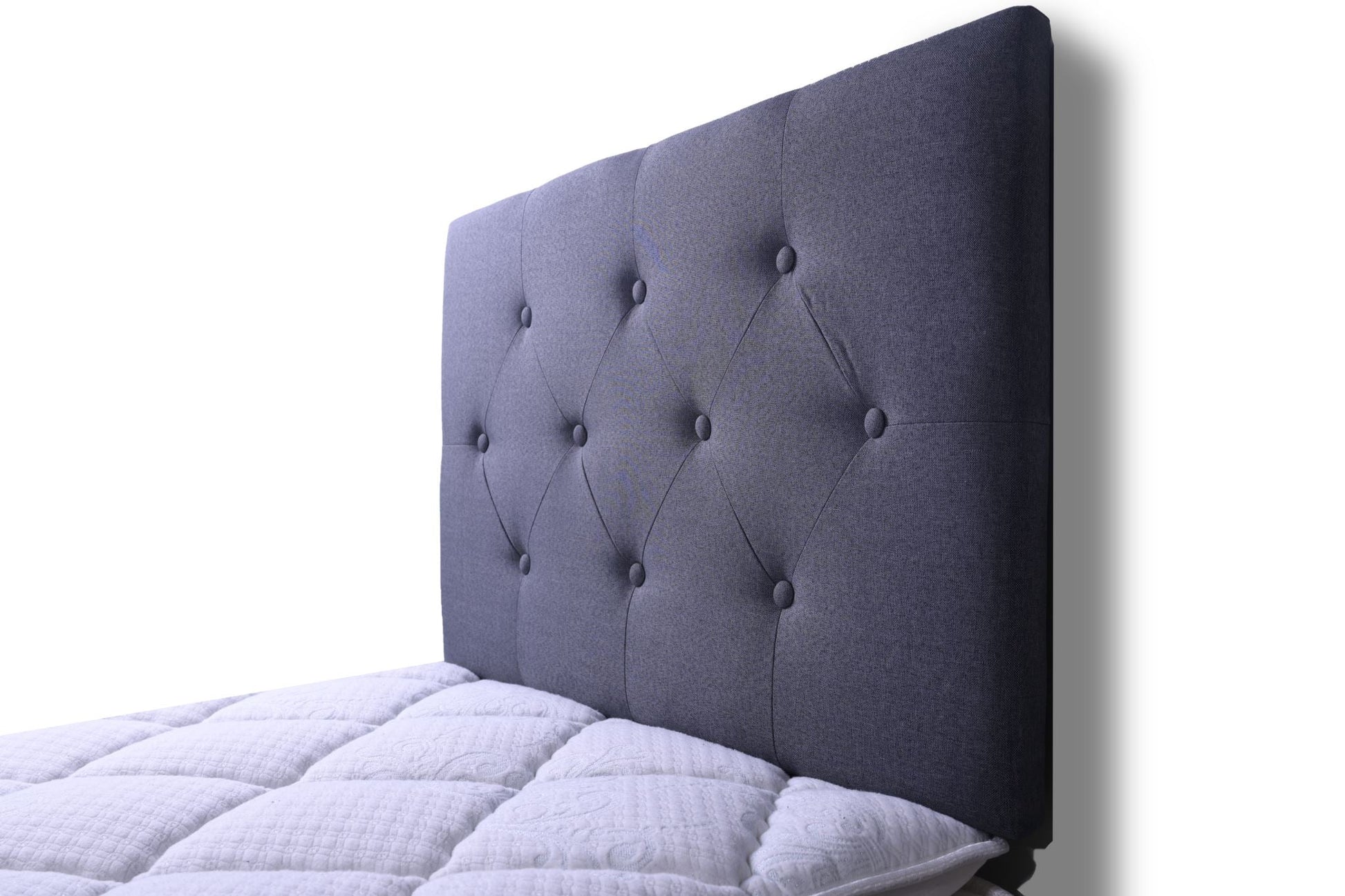 Grey single Fenland headboard by sue-e furniture with padded fabric upholstery and modern design, shown in a bedroom setting.