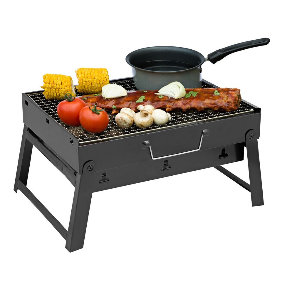 Large black portable charcoal BBQ stove grill from dealonline.co.nz, compact briefcase size with sturdy black finish.