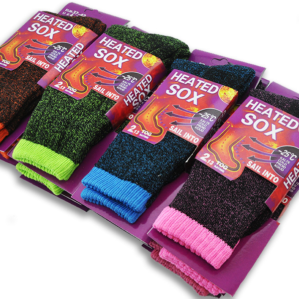 Pair of women's heated crew socks from dealonline.co.nz, shown in black with thermal lining and heating elements visible.