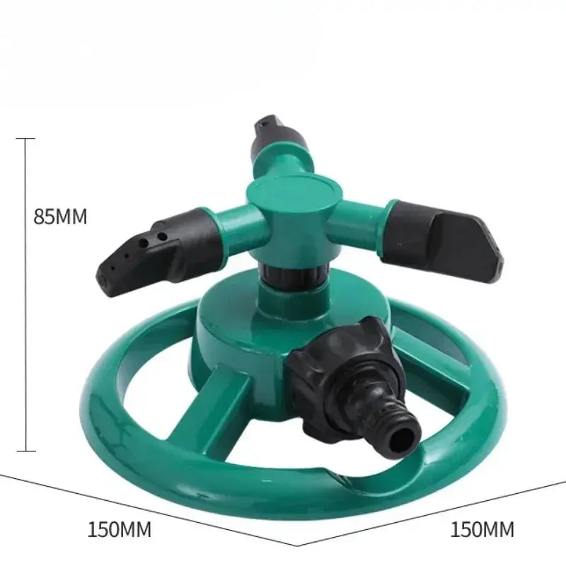 Green Habicare SS 360° automatic rotating sprinkler in action, watering a lawn with even coverage.
