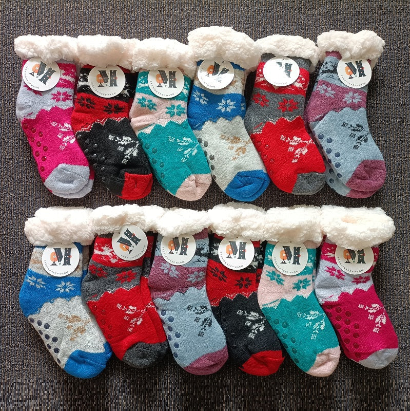 Pair of dealonline.co.nz kids' fuzzy slipper socks with grippers, super warm, soft, and perfect for winter.