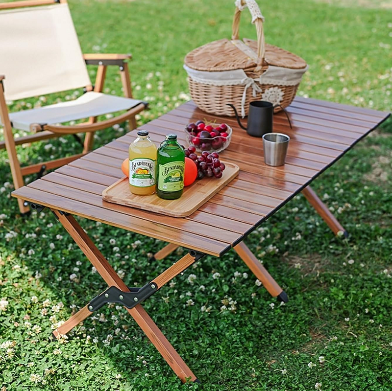 Foldable 90cm camping dining table by dealonline.co.nz, ideal for picnics and outdoor meals, with a sturdy surface and portable design.