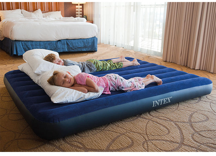Inflatable mattress by Intex, 152x203x25cm, classic Downy design, ideal for guests or camping, shown inflated on a flat surface.