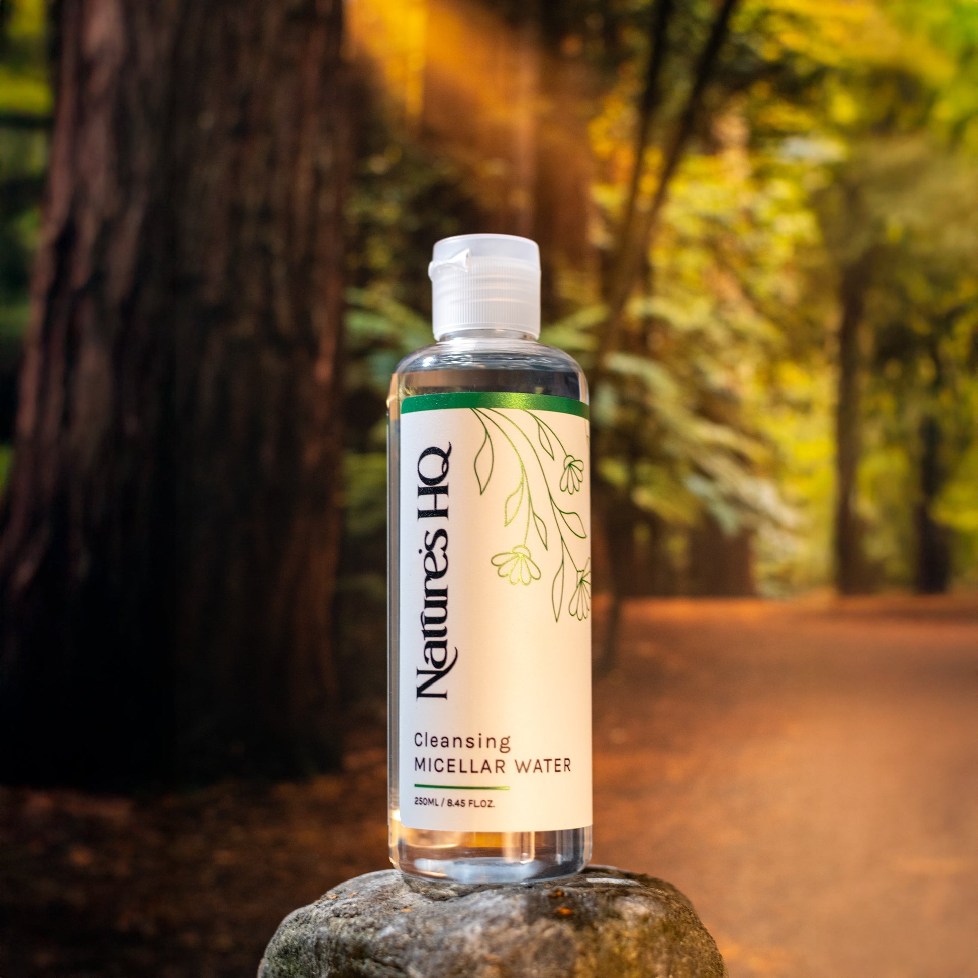 The Honey Collection Cleansing Micellar Water bottle, a gentle facial cleanser with a clear liquid and minimalist label.