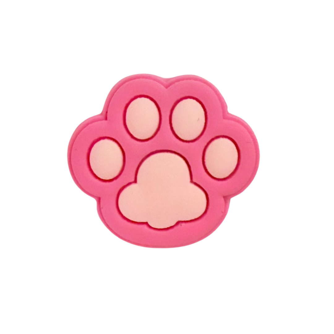 Pink Paw Charm from Walkieez WALK-itz collection, featuring a playful pink paw print design on a colorful rainbow-themed background.