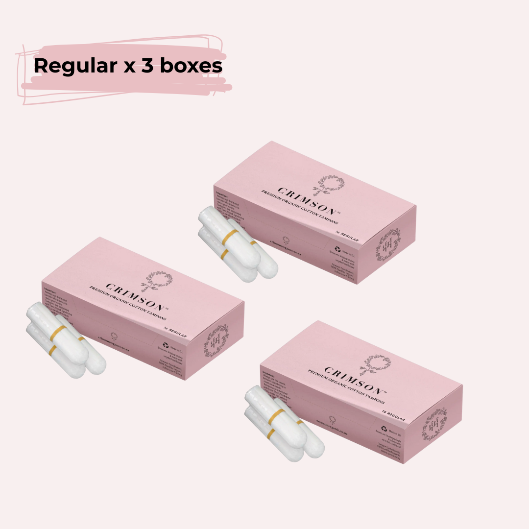 Three boxes of Crimson regular tampons for medium flow, 2-month supply, shown in a natural arrangement.