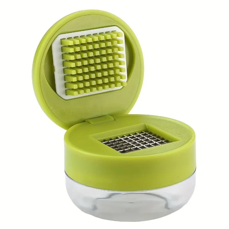 Manual garlic press and ginger mincer from ShopHub NZ, stainless steel kitchen tool for crushing garlic and ginger in cooking.