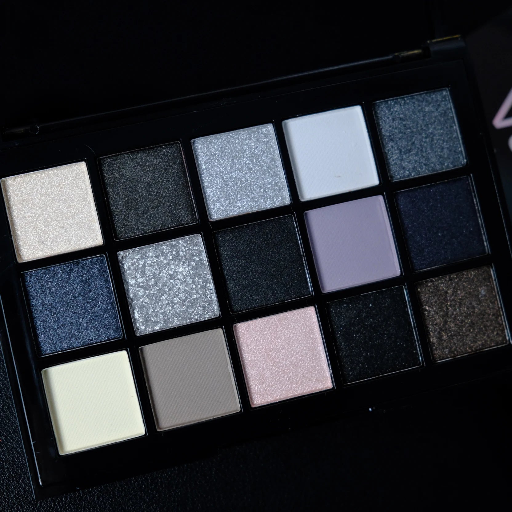 Black smokey eyeshadow palette with 15 shades from ShopHub NZ, showcasing a range of dark, smoky eye makeup colors.