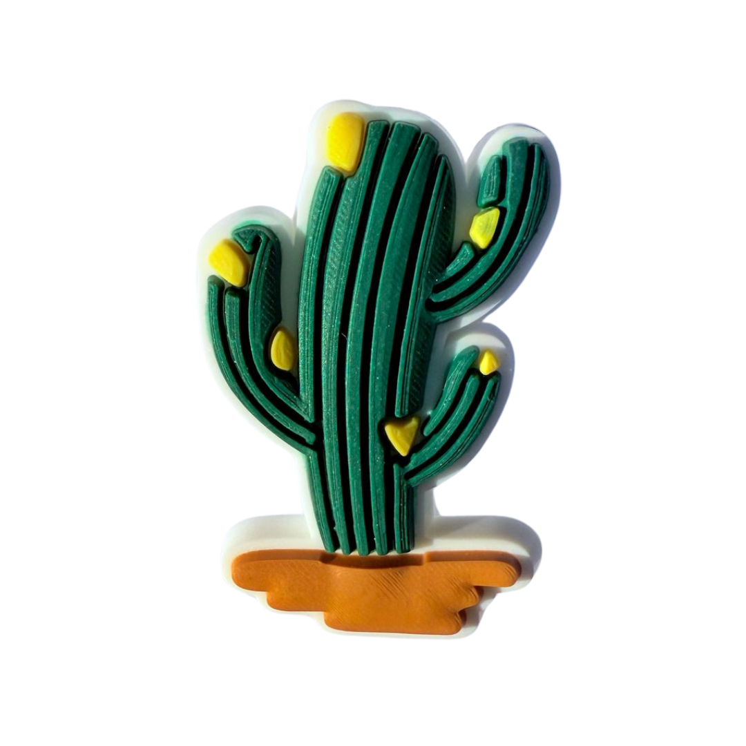 Walkieez WALK-itz cactus charm featuring a small, green cactus design with a silver clasp on a plain background.