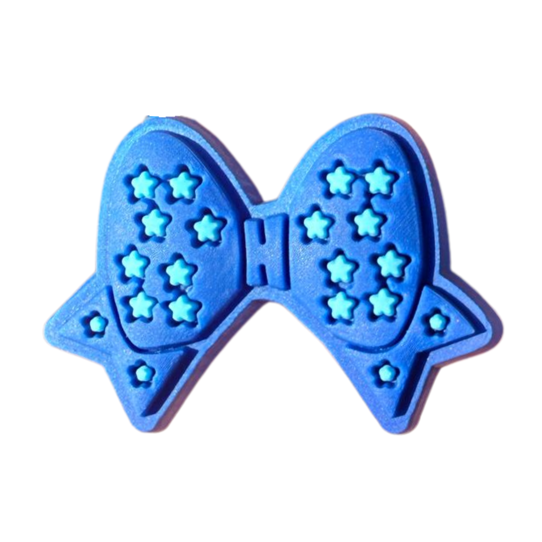 Blue Bow Charm from WALK-itz by Walkieez featuring a cute blue bow accessory.