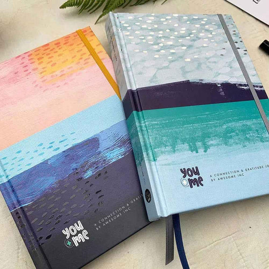 Ocean yellow You + ME Connection Gratitude Journals by Awesome Inc NZ, featuring inspiring designs and space for personal reflections.