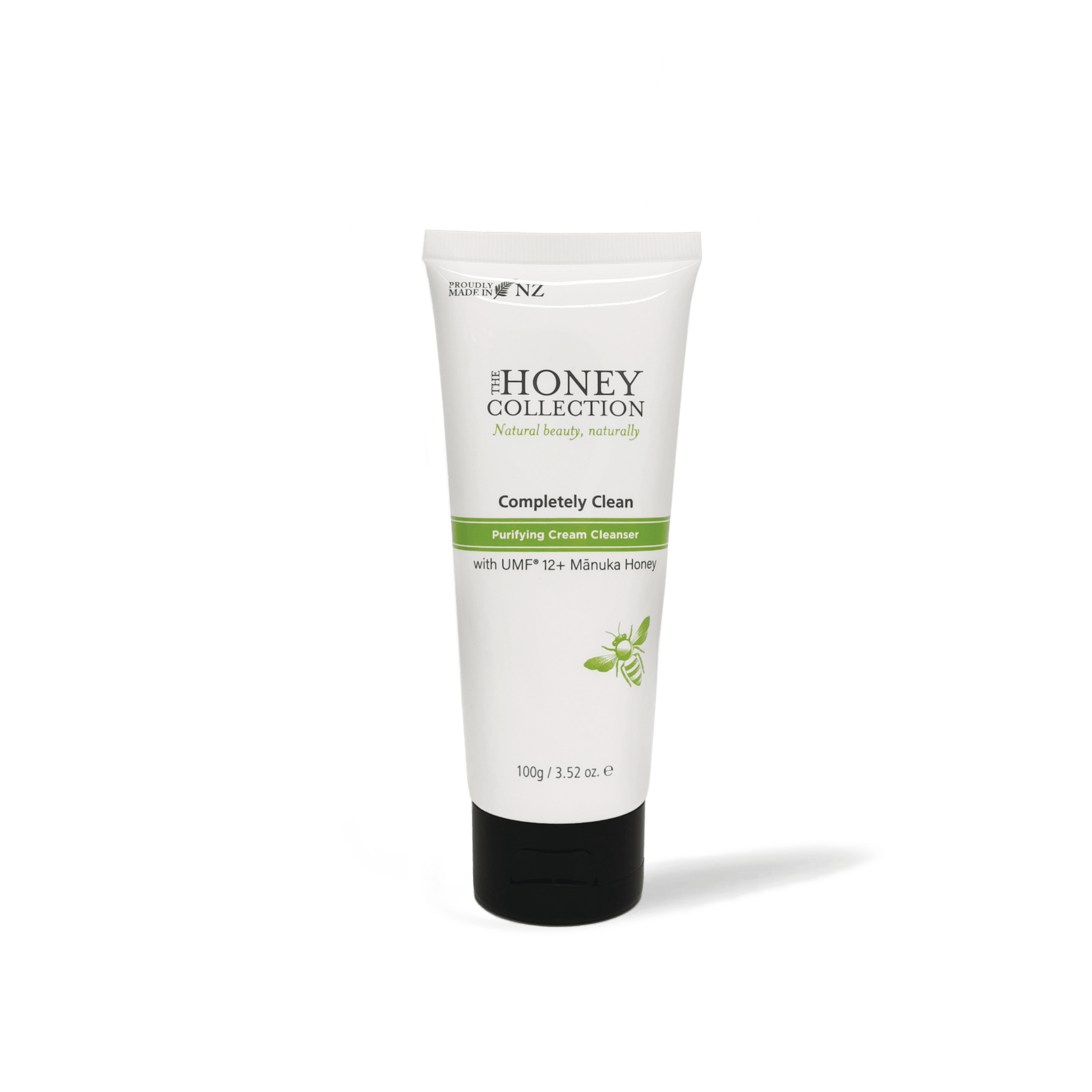 The Honey Collection Completely Clean Purifying Cream Cleanser in a white tube with a flip cap, showing the product label.