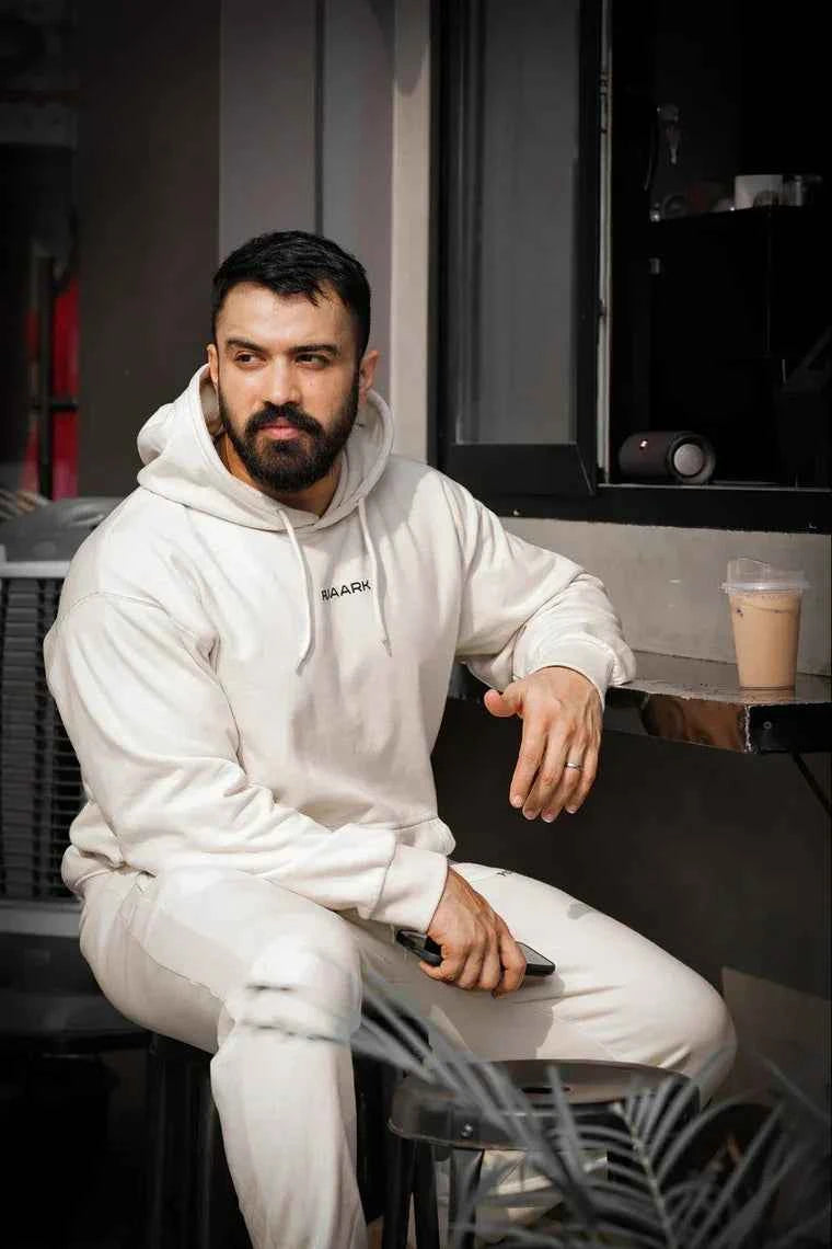 Beige unisex oversized hoodie by Fuaark Nz, showcasing a comfortable, stylish fit with a relaxed silhouette.