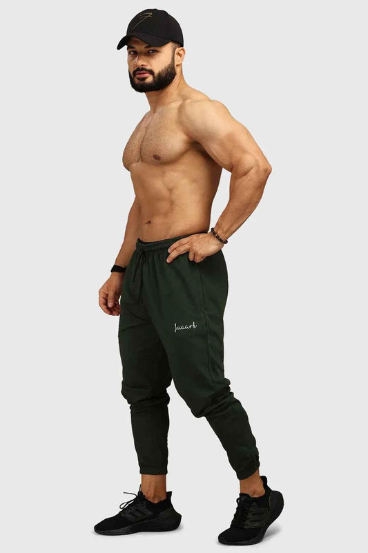 Green fall joggers by Fuaark Nz, comfortable regular fit for autumn style, shown in a relaxed fit with casual design.