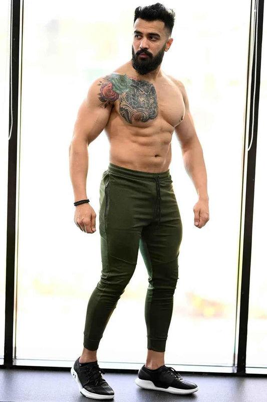 Fuaark Nz melange green joggers for comfortable style, shown on a model, featuring relaxed fit and soft fabric.