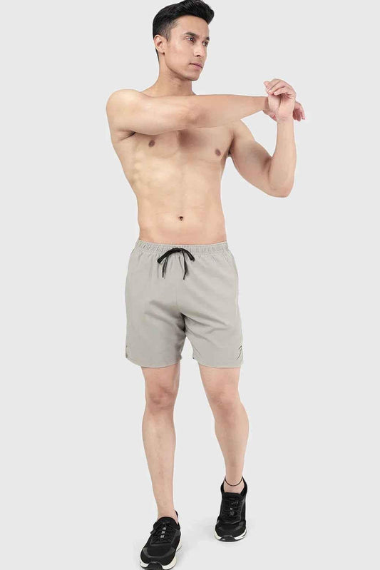 Beige 2-in-1 compression shorts by Fuaark Nz featuring a snug fit and stretchy fabric for active wear and support.