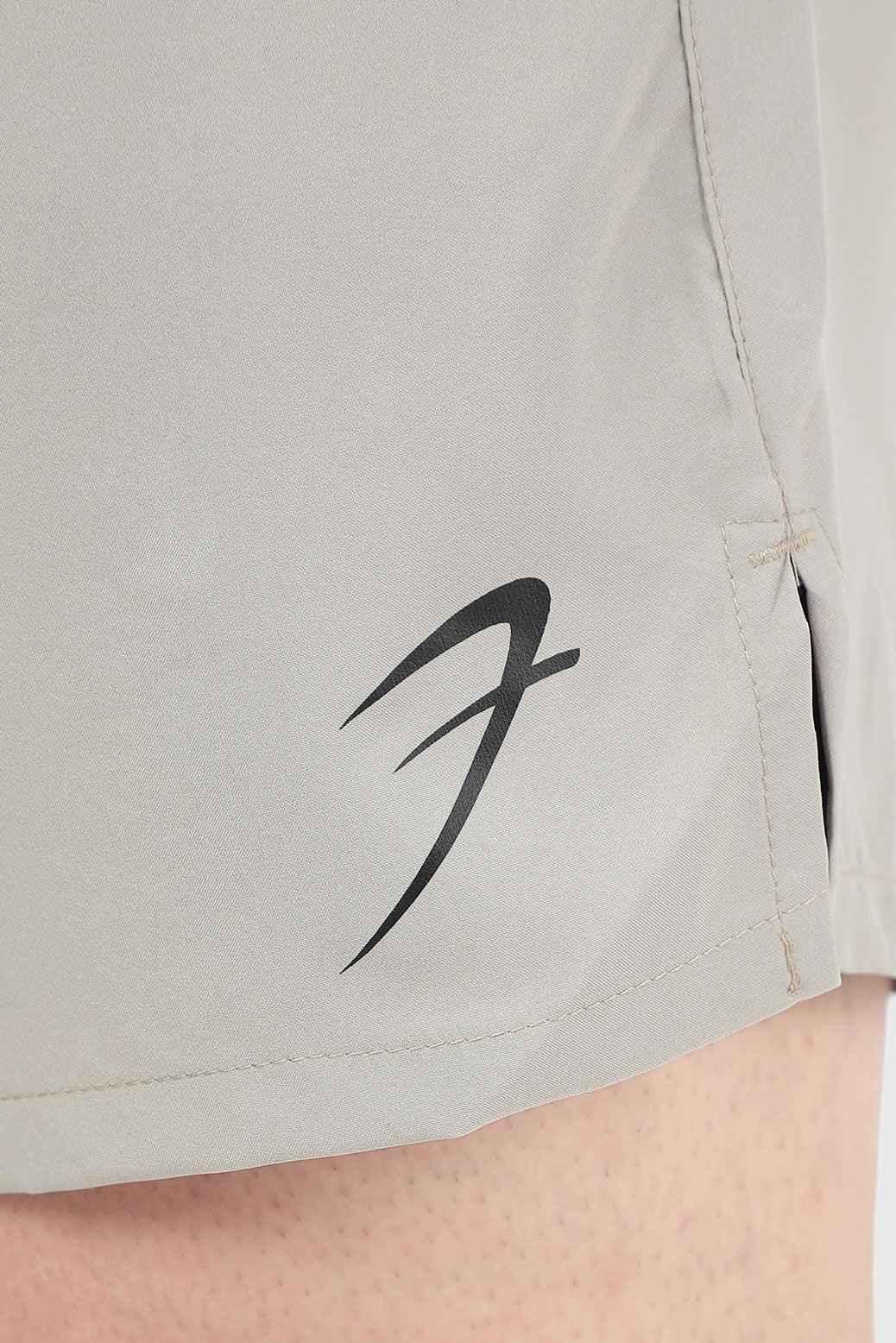 Beige 2-in-1 compression shorts by Fuaark NZ, featuring a snug fit and elastic waistband for active wear and support.