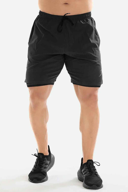 Dark grey 2-in-1 compression shorts by Fuaark Nz, showing the stretchy fabric and sleek design for active wear.