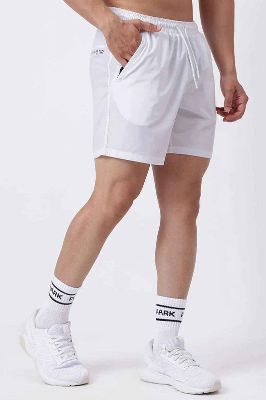 White Nova Shorts by Fuaark Nz displayed on a model, showcasing casual fit and lightweight fabric.