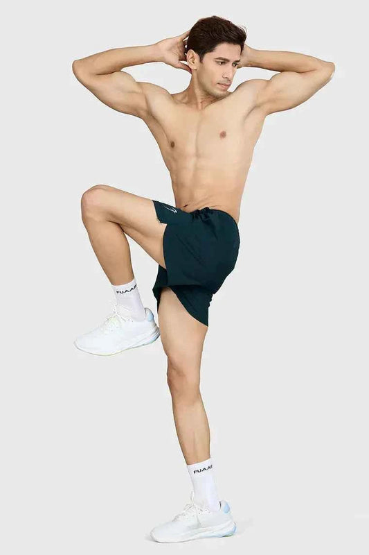 Deep green Pulse 4-inch running shorts by Fuaark Nz, lightweight athletic shorts with a comfortable fit for running.
