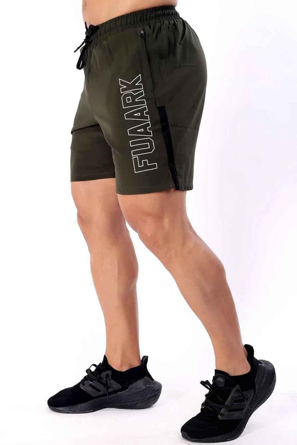 Olive Fuaark Nz Studio Shorts laid flat, showcasing casual elastic waistband and lightweight fabric for comfortable summer wear.