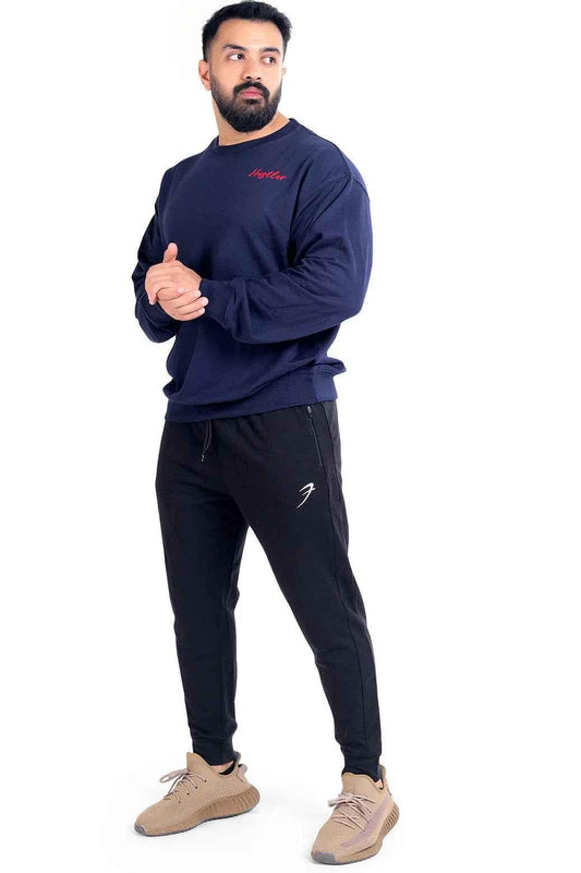 Navy Hustler oversized sweatshirt by Fuaark Nz, featuring a relaxed fit and soft fabric, displayed on a hanger.