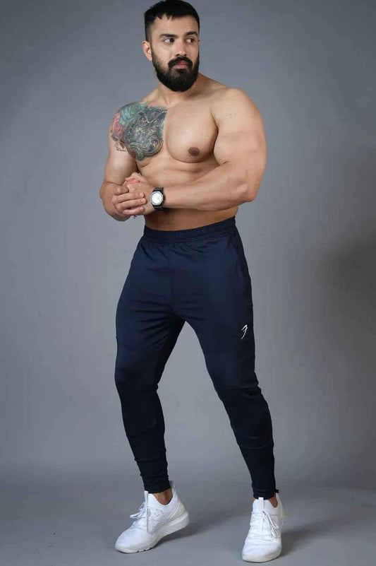 Fuaark Nz Hybrid Slim Tracks in navy color, lightweight track pants with a modern slim fit design.