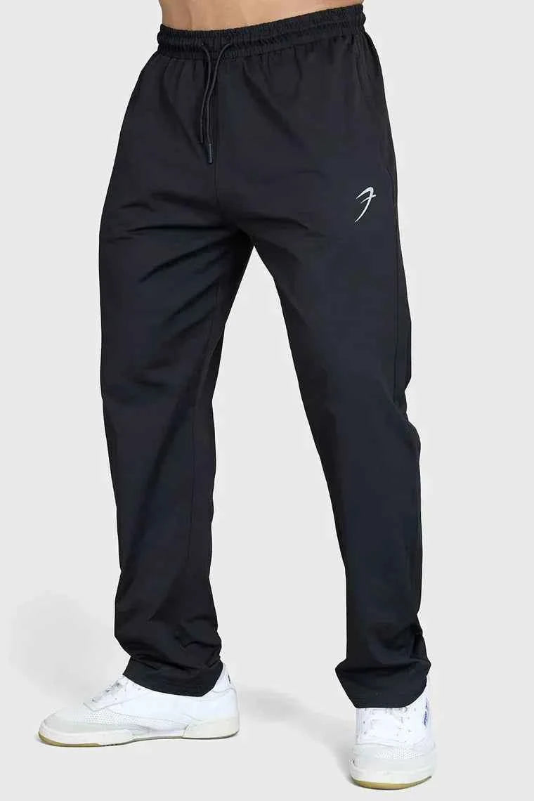 Fuaark NZ black casual track pants for men, featuring a relaxed fit and comfortable elastic waistband, suitable for everyday wear.