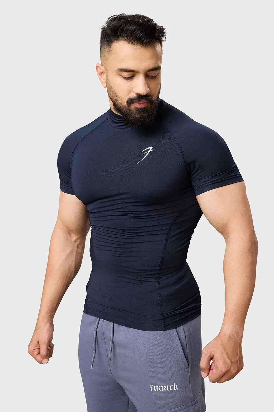 Navy high neck compression T-shirt by Fuaark NZ, close-up of fitted athletic T-shirt with high neckline and smooth fabric.