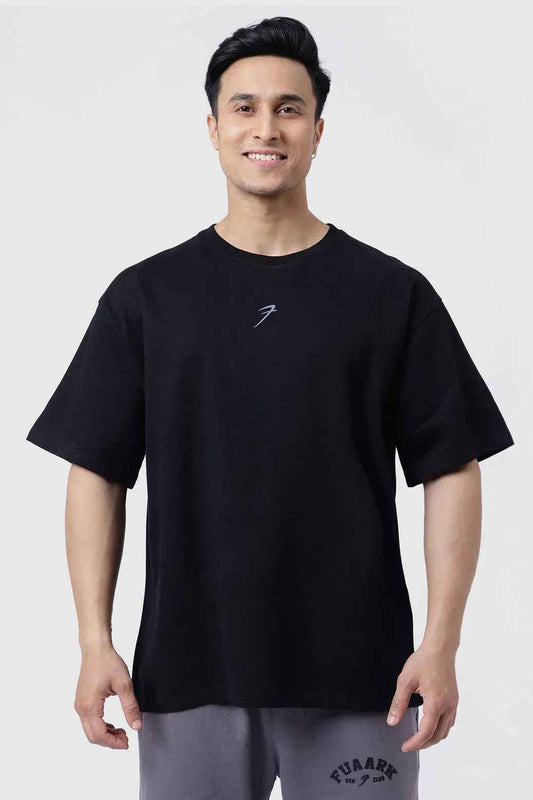 Black Fortitude oversized T-shirt by Fuaark Nz, showcasing a relaxed fit and casual style in the image.
