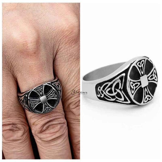 Stainless steel Celtic Cross ring with Celtic knot symbols, featuring intricate engraved designs on a sleek band.