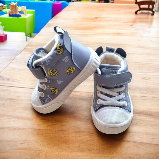 Happy Feet NZ plush high-top sneakers with soft, secure fit and playful design for kids, shown in a colorful, cozy style.