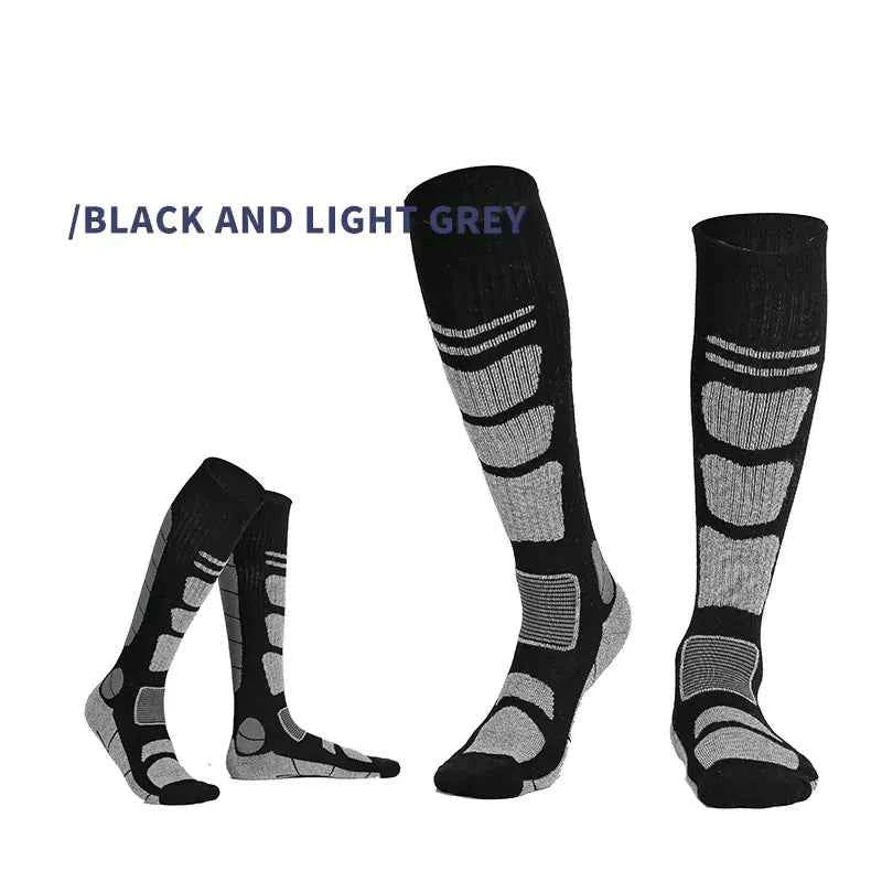 Dark grey and black over-the-knee wool hiking socks by Mead's Supply & Equipment for outdoor adventures and trail walking.