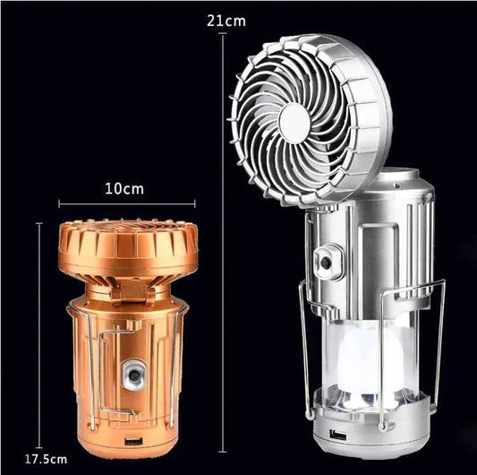Mead's Supply & Equipment Outfitters solar camping lantern fan with rechargeable LED light and cooling fan in silver, outdoors.