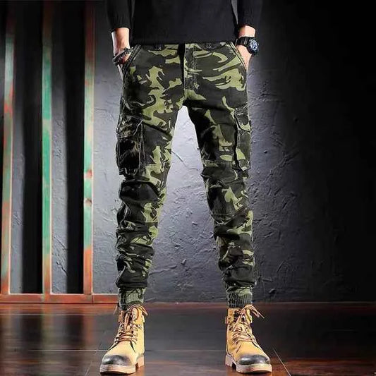 Men's oversized camouflage cargo pants by Mead's Supply & Equipment Outfitters, multi-pocket outdoor trousers in khaki.