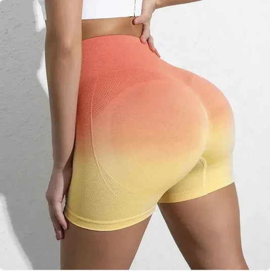 Women's high-waist gradient yoga shorts by Mead's Supply & Equipment Outfitters, green athletic workout shorts for gym and fitness.