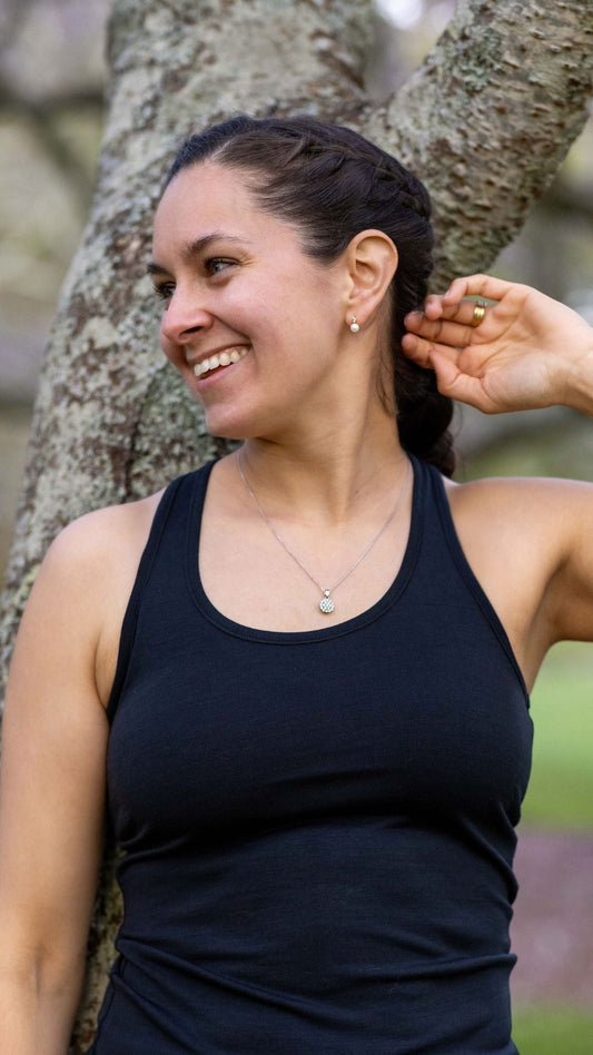 Black women's racerback tank top made from Merino blend, lightweight and breathable, by Merino 365 NZ.