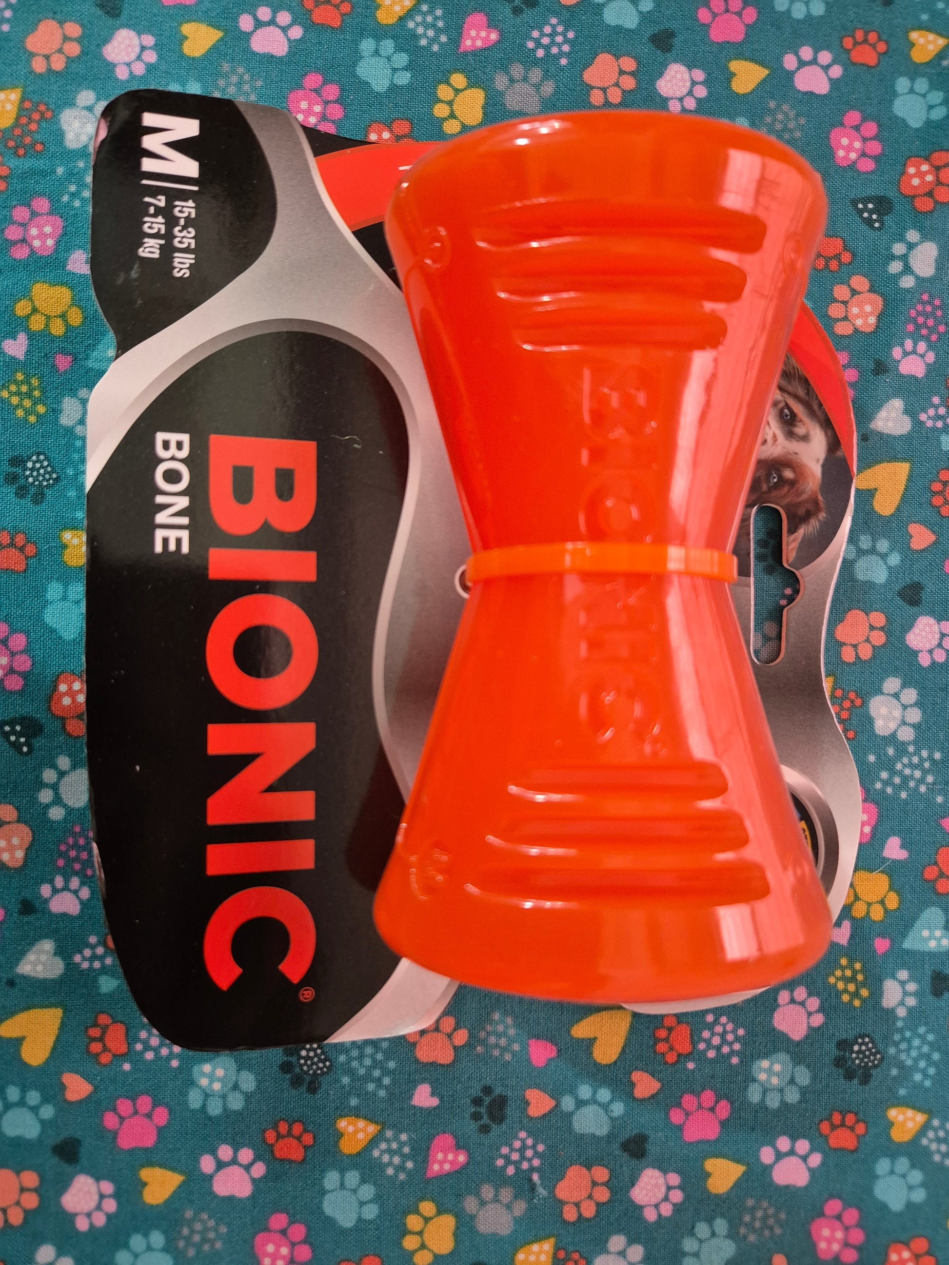 Medium BIONIC Bone toy by Animal Addiction Limited, showing a durable rubber chew toy with textured surface for dogs.