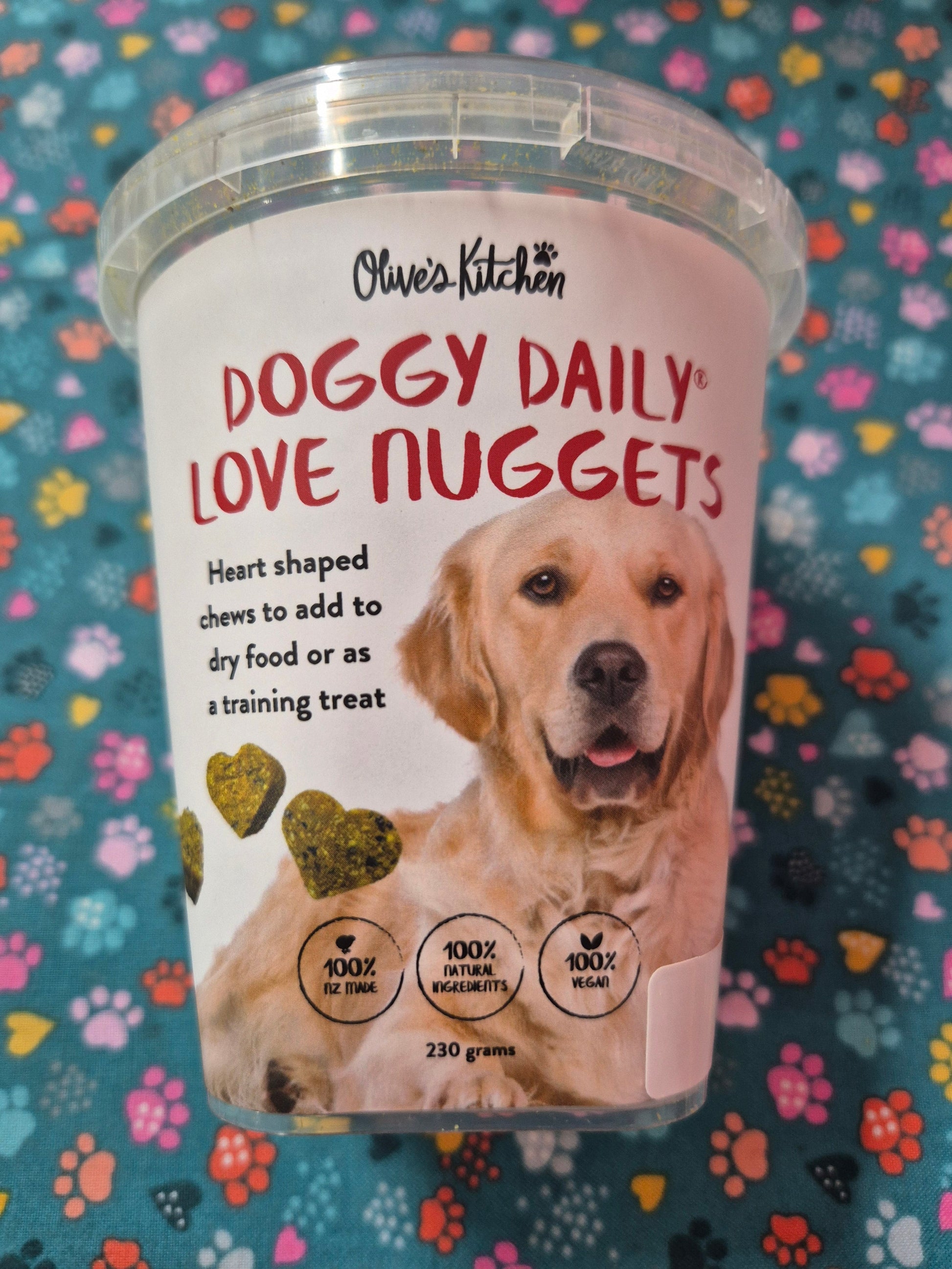 Doggy Daily Love Nuggets by Animal Addiction Limited, small dog treats with bone-shaped design on a white background.