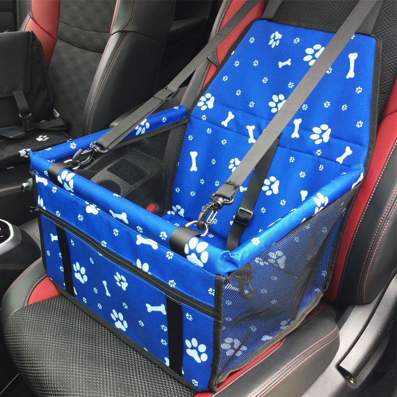 Blue waterproof pet car seat cover with paw and bone pattern, designed for cats and dogs to protect car seats during travel.