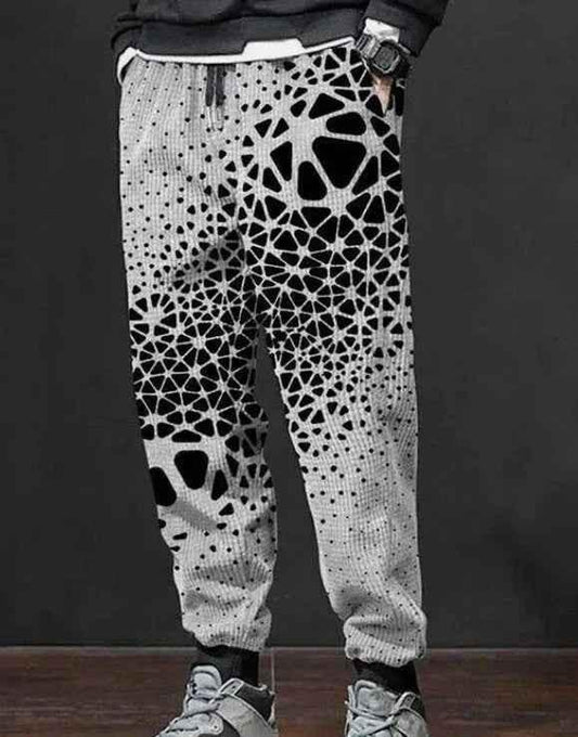 Men's printed sweatpants by Stylish 3Sixty5 with bold all-over print and tapered comfort fit, shown in a relaxed style.