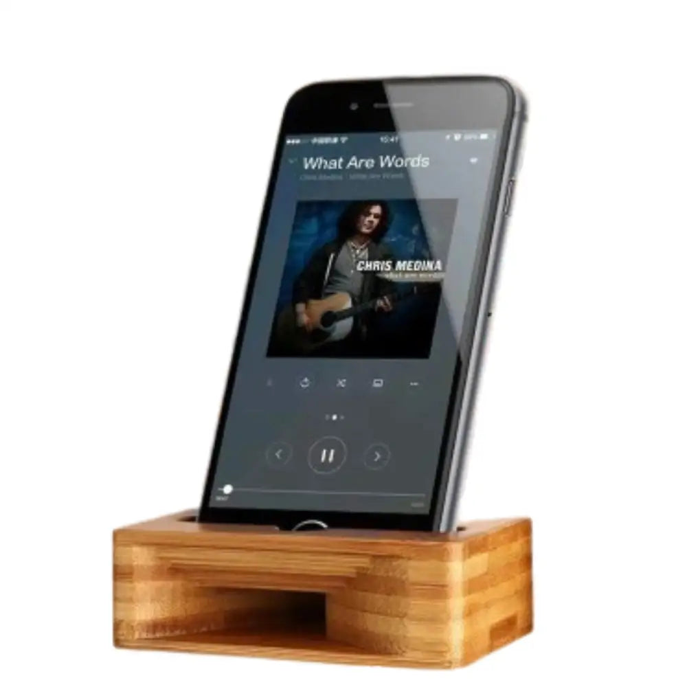 Wooden 9eight5 phone stand and sound amplifier by Habicare, featuring a sleek natural wood design for hands-free phone use.