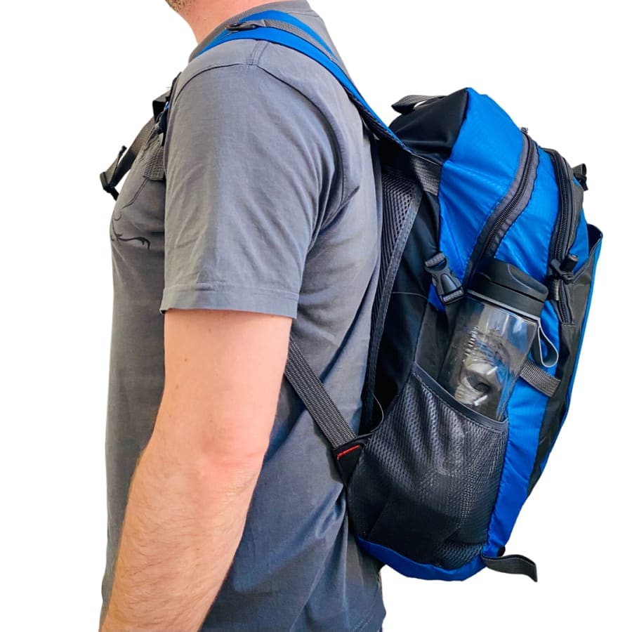 Red and black 9eight5 backpack with adjustable straps, front pocket, and spacious main compartment, measuring 51cm x 31cm x 18cm.