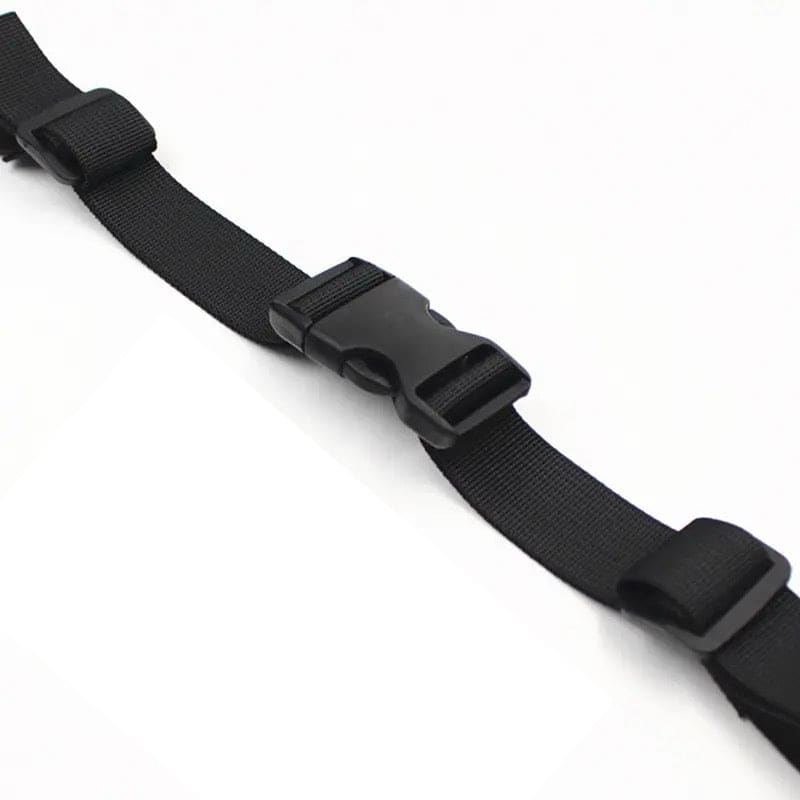 Black 9eight5 backpack chest strap attached to a backpack, adjustable strap for comfort and secure fit during outdoor activities.
